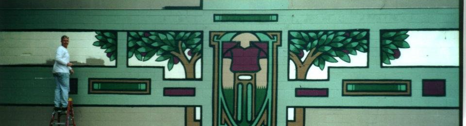 The art depicted in the image is a stylized, geometric mural. It features strong, clean lines and a symmetry that suggests an Art Deco influence